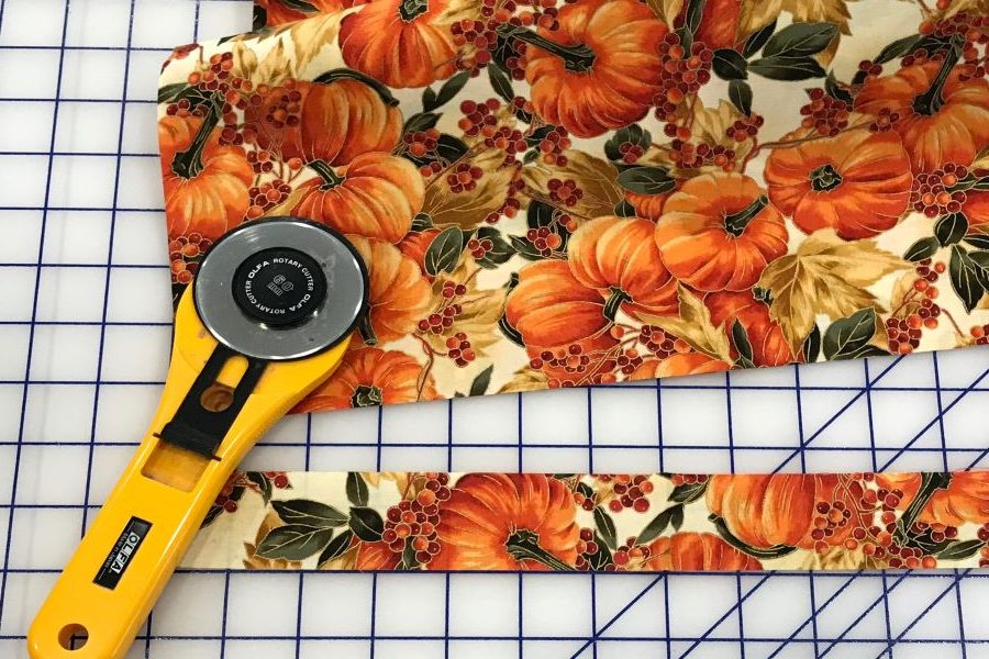 pumpkin fabric and rotary cutter