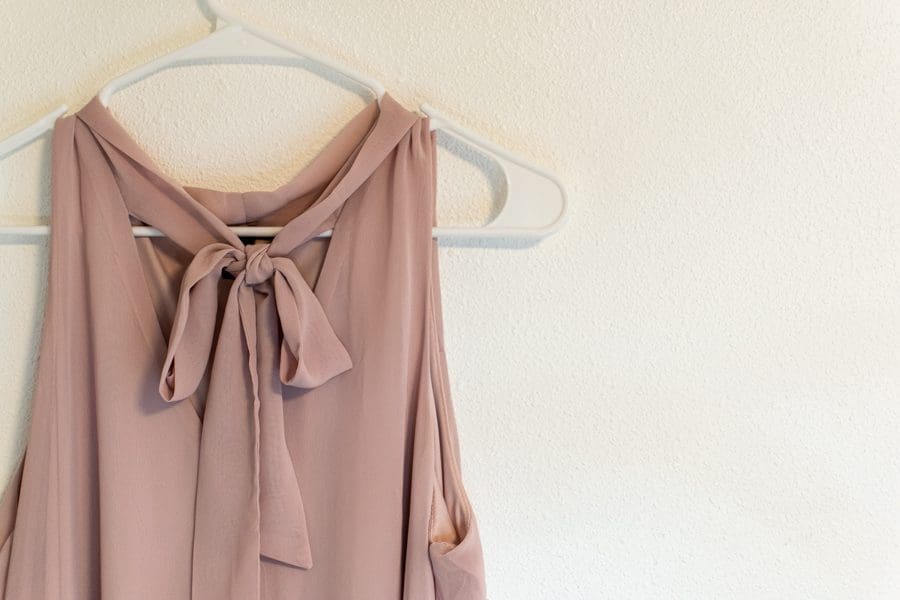 Crepe top with dress on a hanger