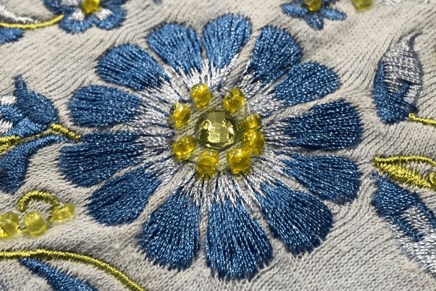 Embroidery closeup of sew on crystal