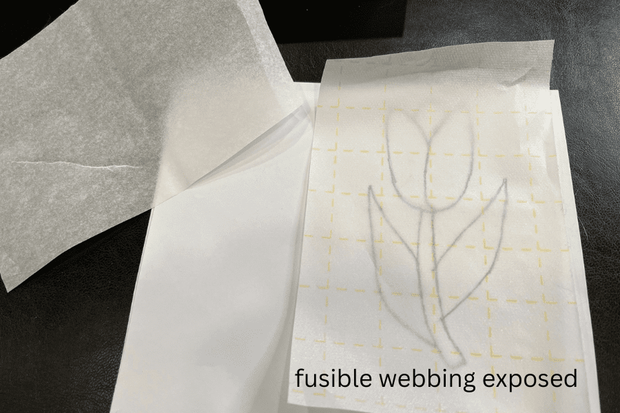 Fusible webbing exposed over sketch