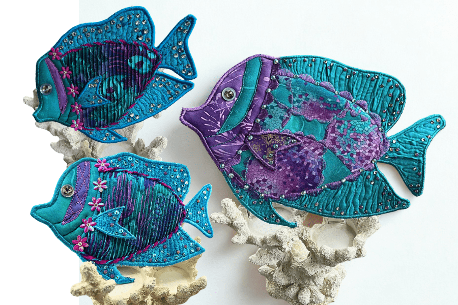 3 fish made from fabric and used as wall decor